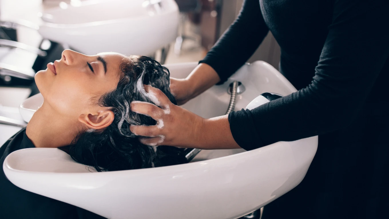 Woman getting her hair washed